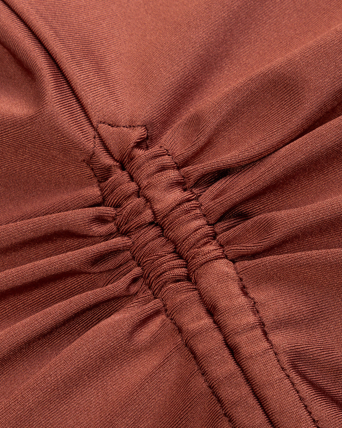 Close-up of brown fabric with a gathered texture
